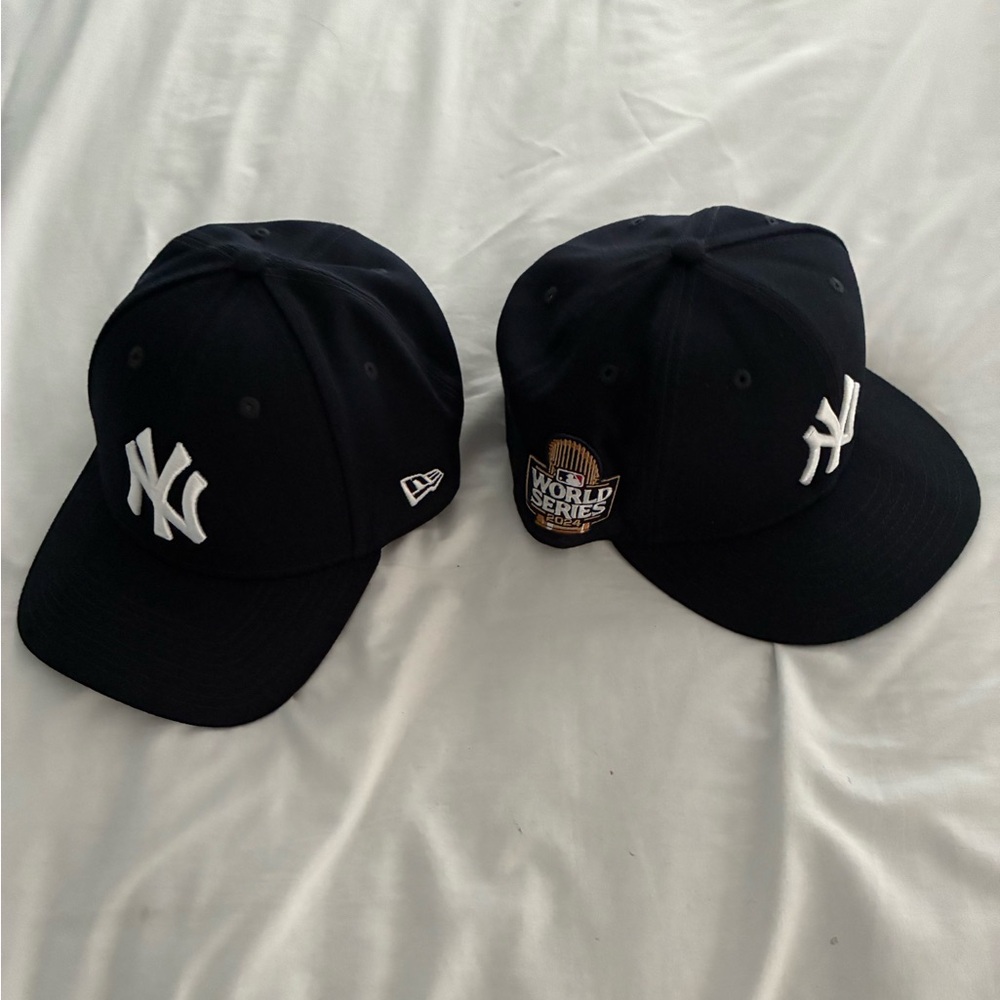 YANKEES “DOUBLEHEADER” -- Two Yankees baseball caps.